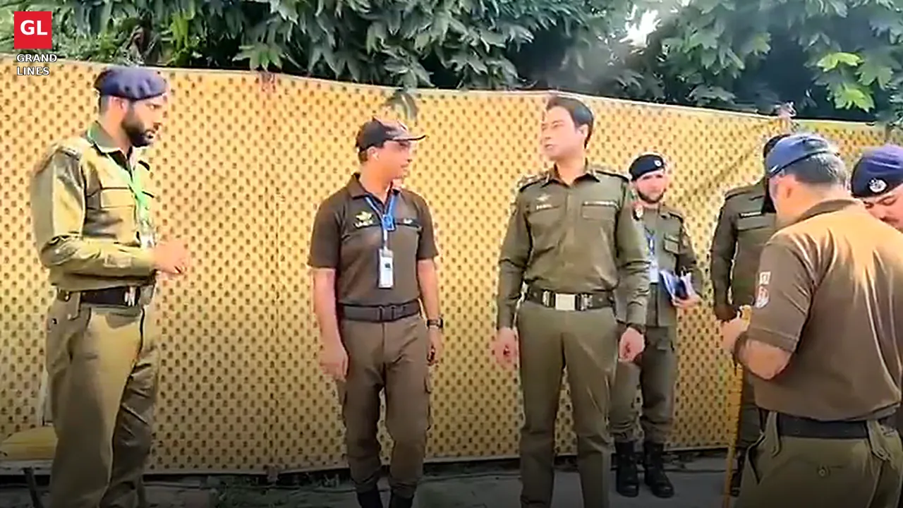 A senior police officer briefs personnel deployed along the screening fence outside the stadium. A senior police officer briefs personnel deployed along the screening fence outside the stadium.