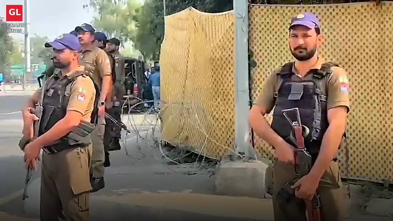 Armed police personnel stand guard at the barbed-wire cordon around Gaddafi Stadium. Armed police personnel stand guard at the barbed-wire cordon around Gaddafi Stadium.