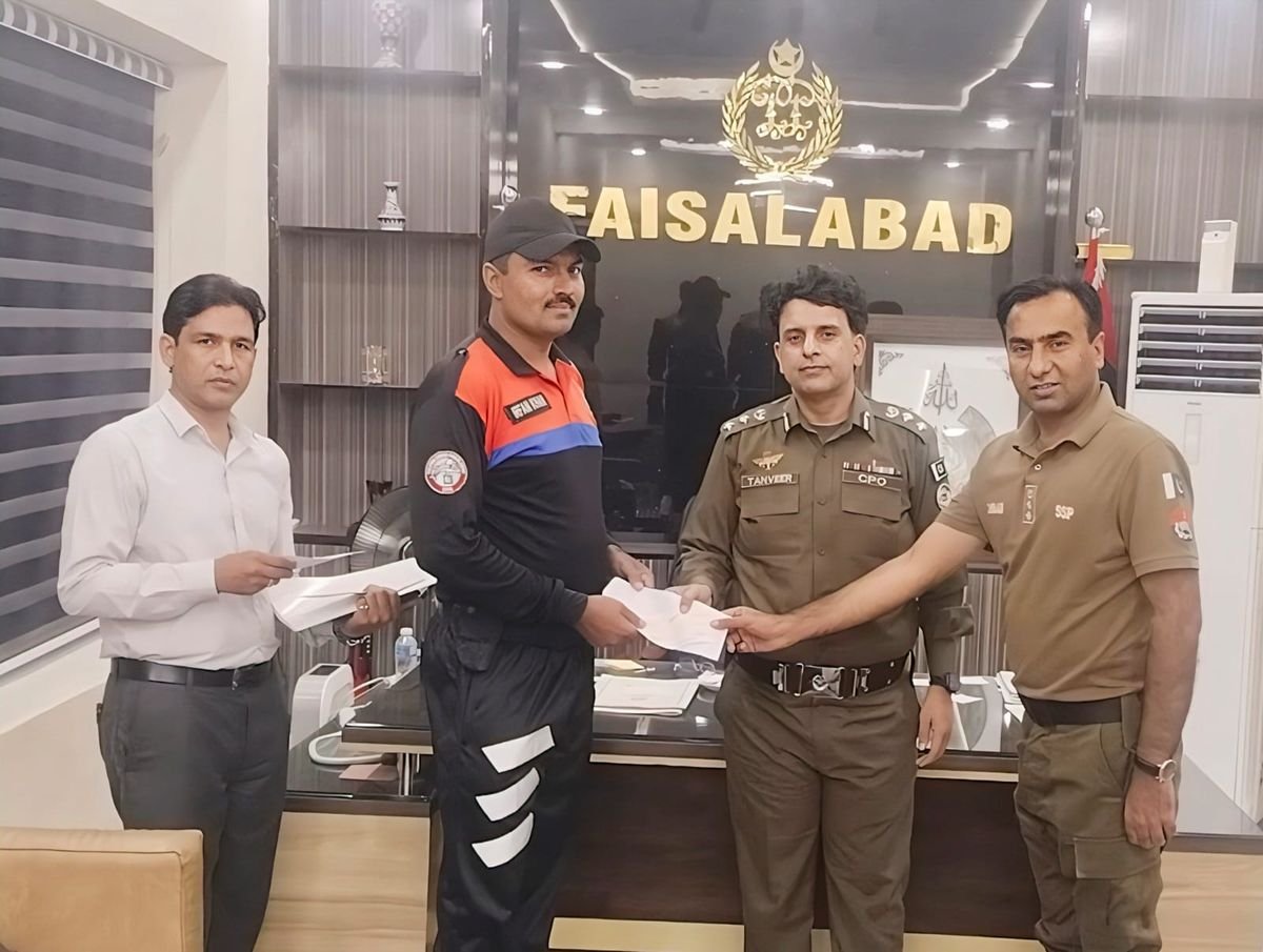 CPO and SSP Operations hand a certificate to a Dolphin Force member