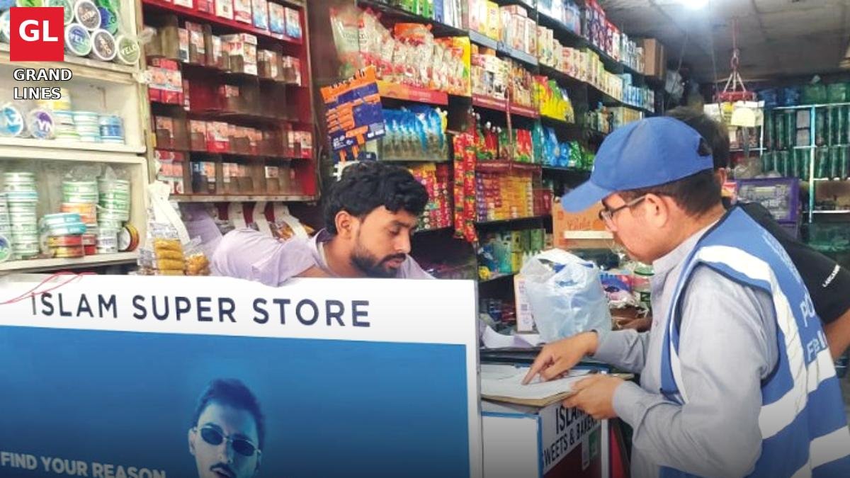 A PCRWR team member collects a water sample at a shop in Faisalabad