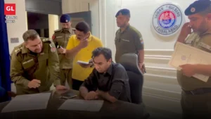 SSP Operations Imran Ahmad Malik checks the record at Gulberg police station during a surprise visit in Faisalabad.