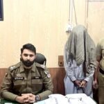 SHO City Jaranwala Muzaffar Ali with arrested drug smuggler and recovered hashish