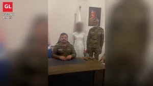 SHO Sargodha Road Ghazi Rizwan Javed with an arrested accused and a recovered pistol at his office in Faisalabad.