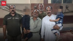 Sadar police officers hand over the two traced toddlers to their family in Faisalabad