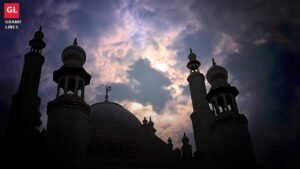 A mosque silhouetted against the evening sky