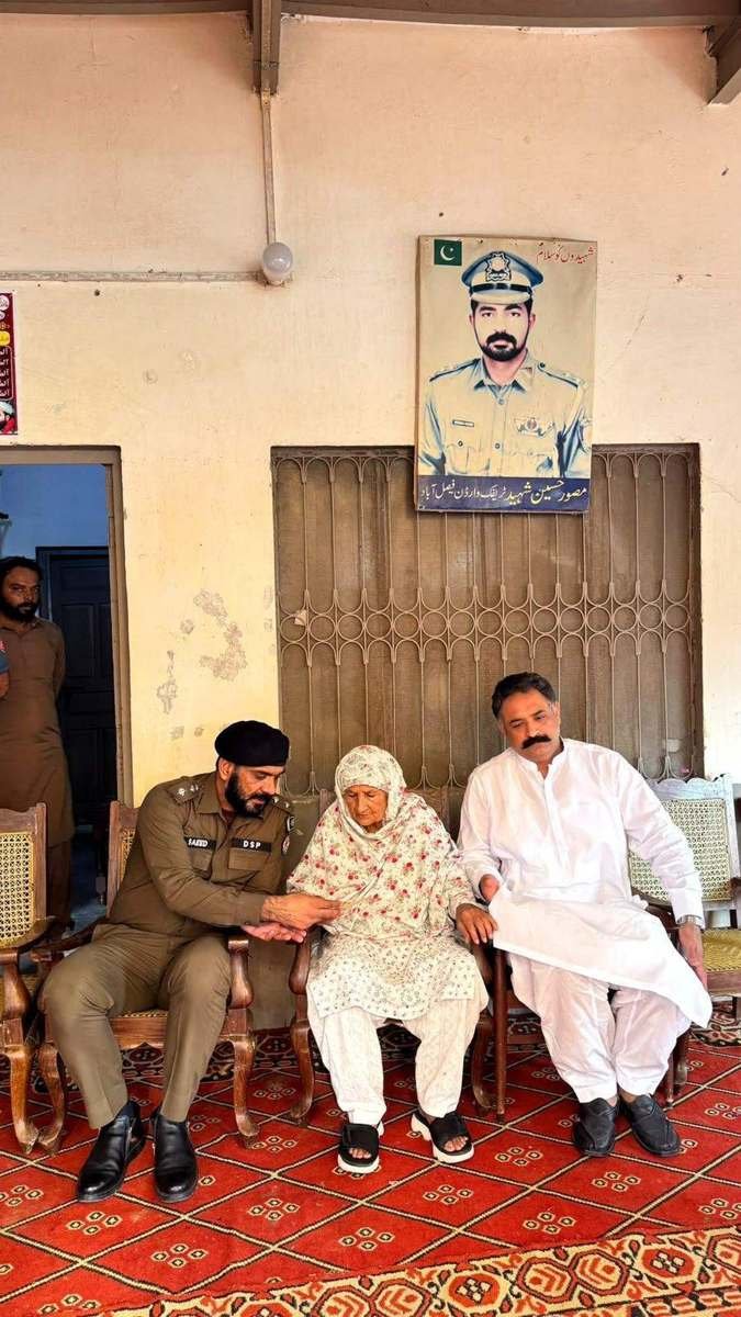 DSP Muhammad Saeed Gorsi meets the mother of martyred Traffic Warden Musawwar Hussain