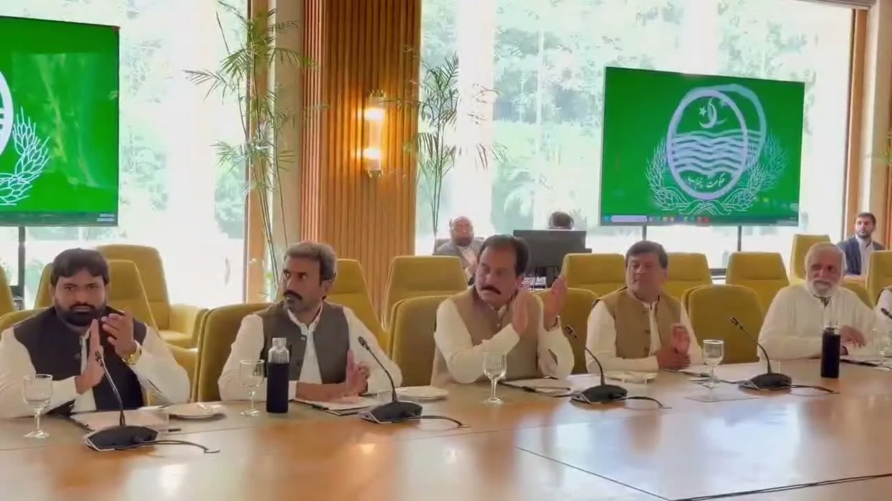 Farmers welcome announcements: farmer representatives applaud during the Lahore meeting. Farmers welcome announcements: farmer representatives applaud during the Lahore meeting.