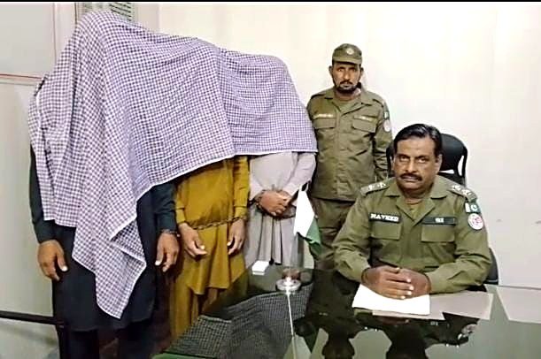 Arrested suspects presented at a Faisalabad police station