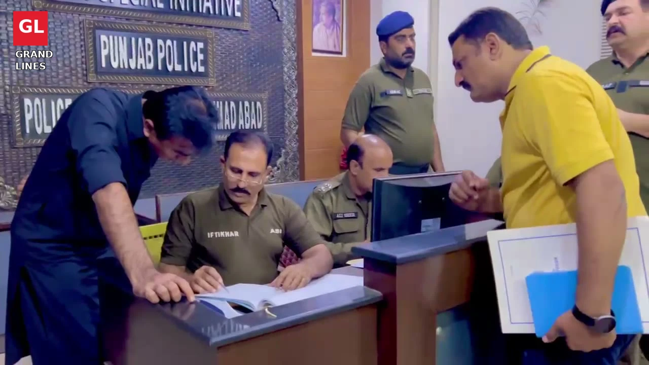 SSP Operations Imran Ahmad Malik checks the front desk record during the surprise round of Faisalabad police stations.