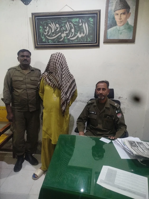 Faisalabad domestic assault arrest: accused in custody with officers. Faisalabad domestic assault arrest: accused in custody with officers.