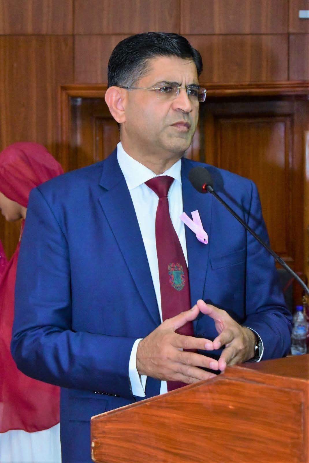 Speaker addressing GCUF breast cancer awareness symposium in Faisalabad
