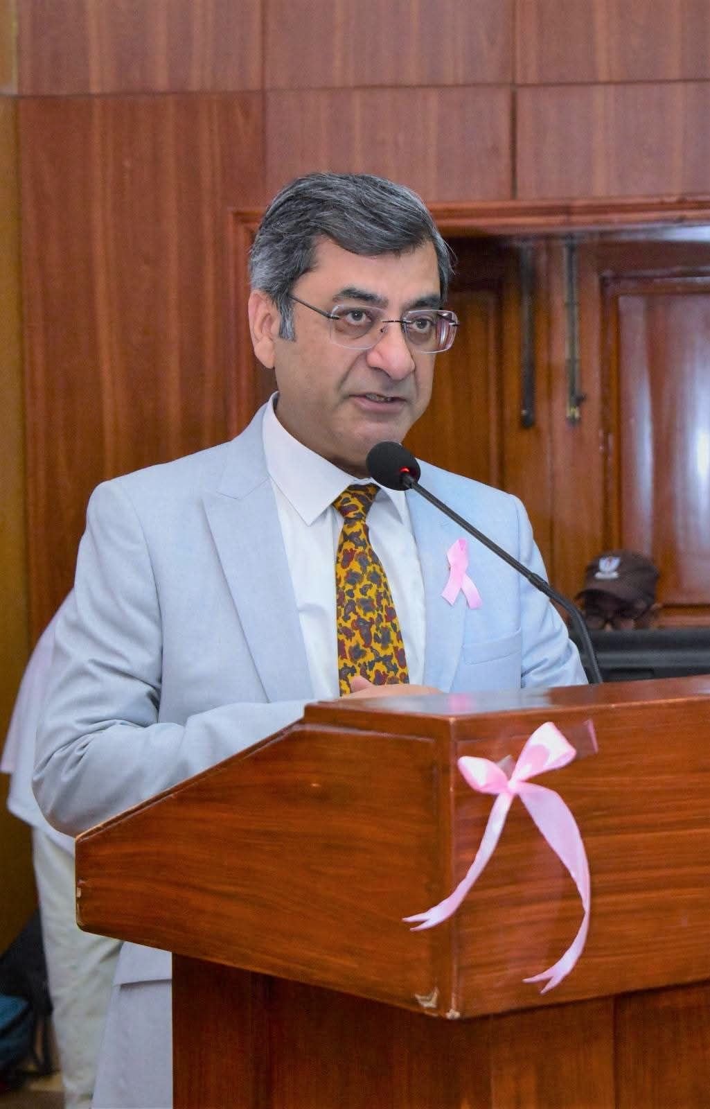 Speaker addressing GCUF breast cancer awareness symposium in Faisalabad