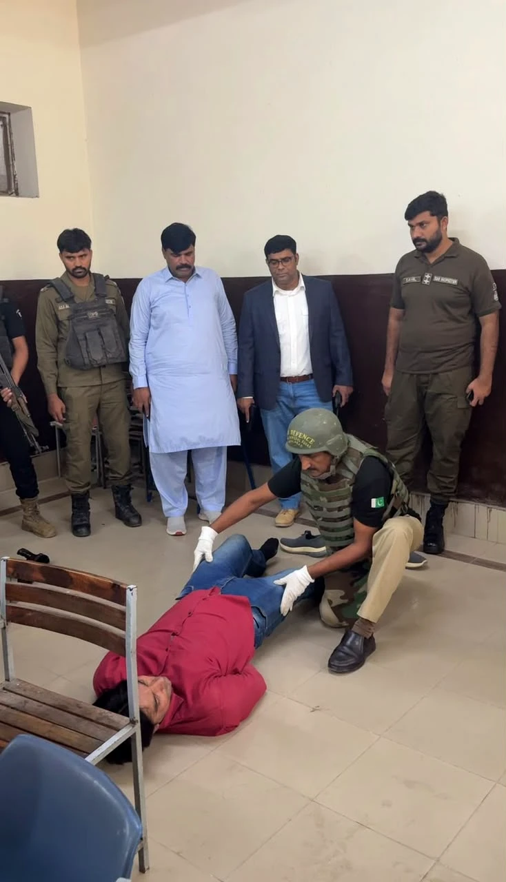 Law enforcement personnel practise emergency response during a mock exercise in Faisalabad.