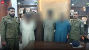 Arrested suspects with police officials at Nishtar Colony police station in Lahore