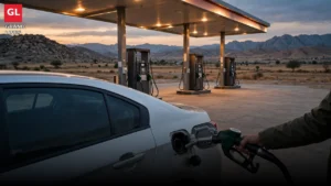 A car being refuelled at a petrol station at dusk