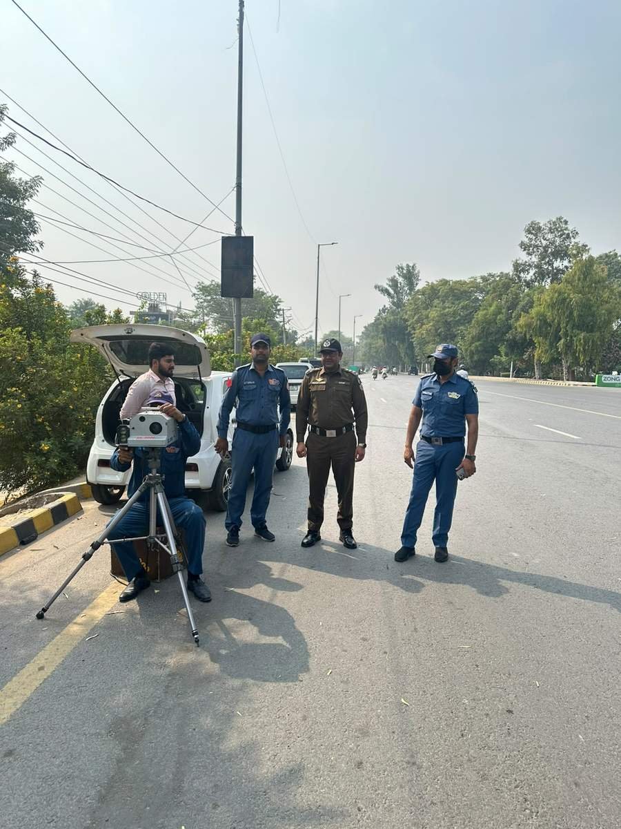 Traffic police team conducting speed checking on Canal Road Faisalabad