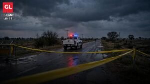 Police encounters in Punjab: a police pickup behind yellow crime-scene tape on a dark rural road at dusk