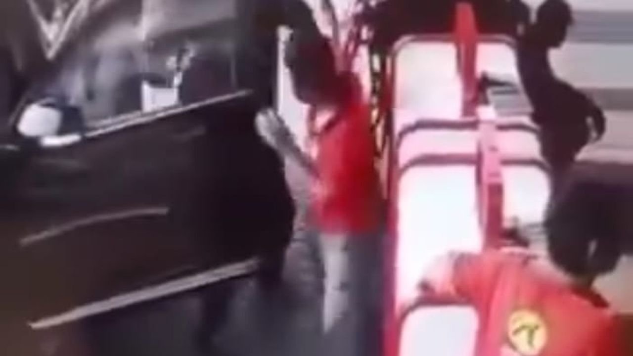 Prado driver confronts a petrol pump worker beside the open car door