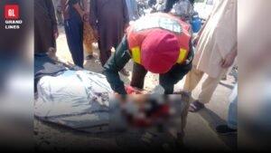 Rescue 1122 team at Samundri Road motorcycle accident spot, woman's face blurred