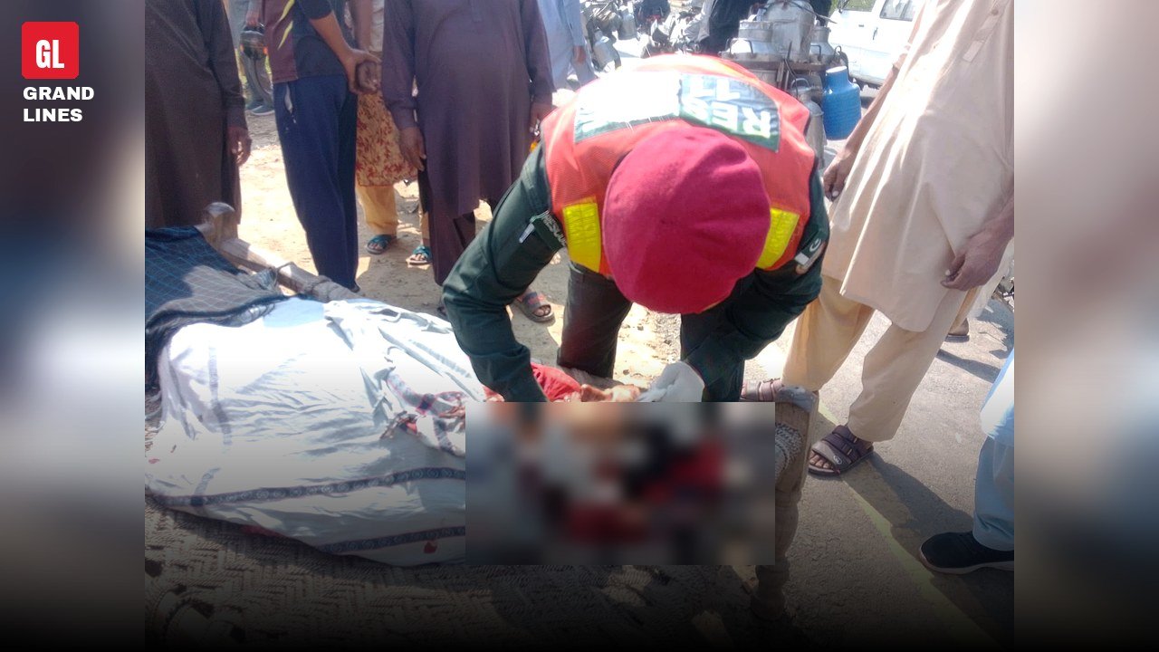 Rescue 1122 team at Samundri Road motorcycle accident spot, woman's face blurred