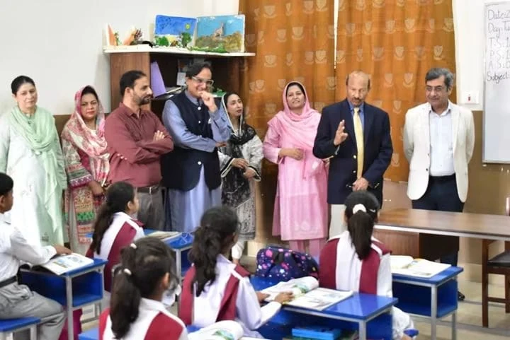 The vice chancellor with a group in a classroom