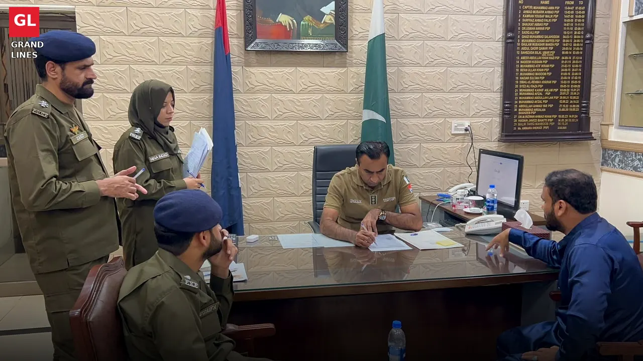 SSP Operations Imran Ahmad Malik records an applicant's complaint during the open court at his office.