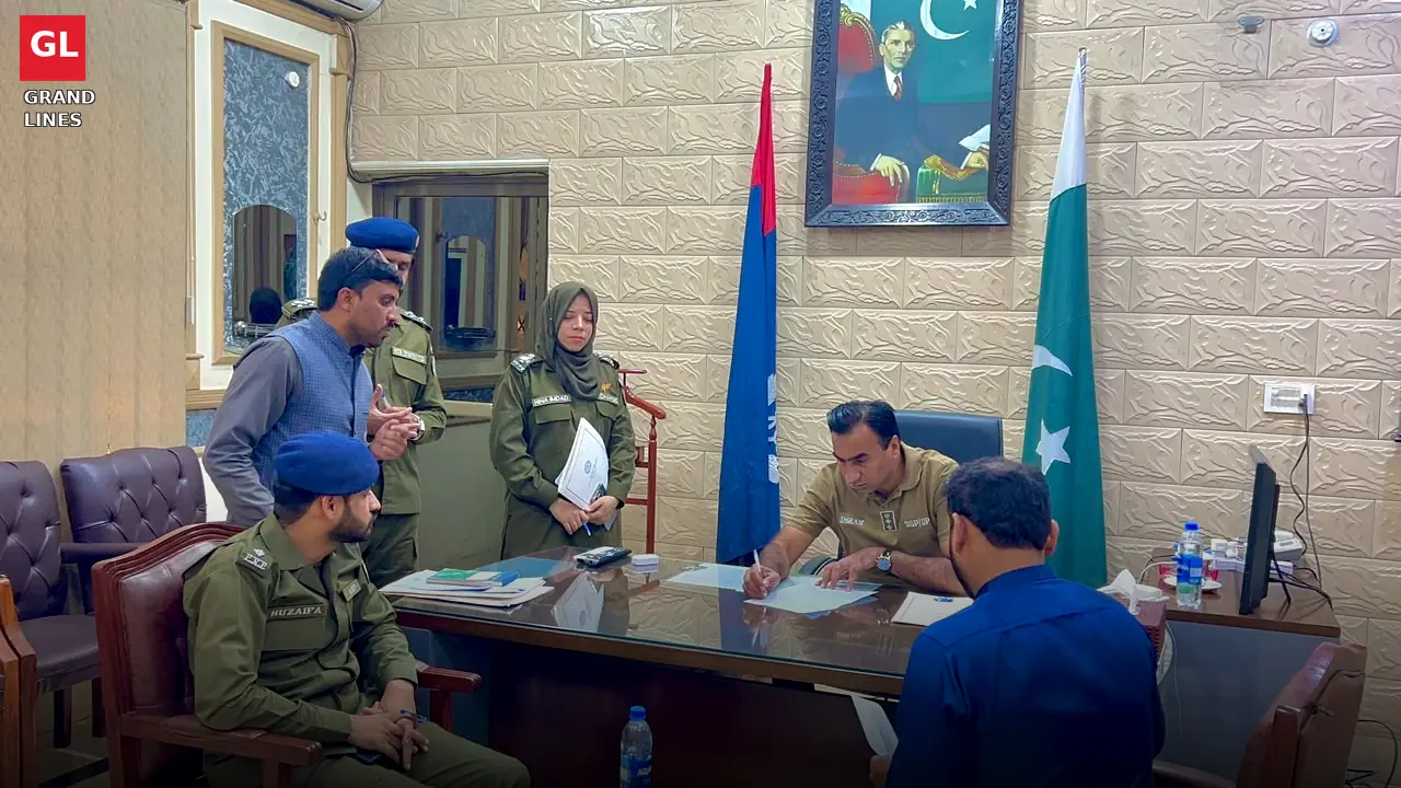 An applicant presents his case as SSP Operations Imran Ahmad Malik signs orders during the open court.
