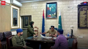SSP Operations Imran Ahmad Malik hears a citizen at the open court in his Faisalabad office.