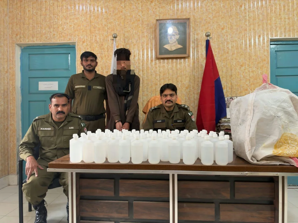 Seized liquor bottles displayed at Sadar police station in Faisalabad.